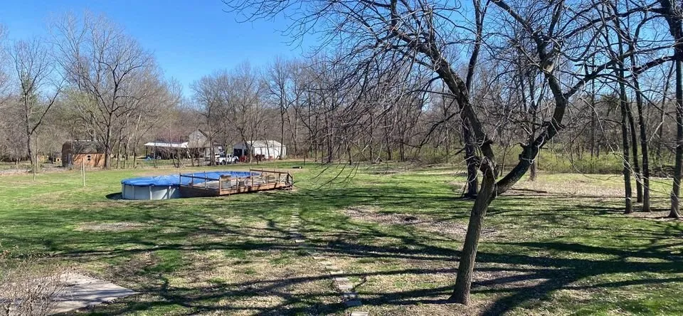 Professional lawn mowing service for homes in Buckner, MO by 114 Farm & Home Realty