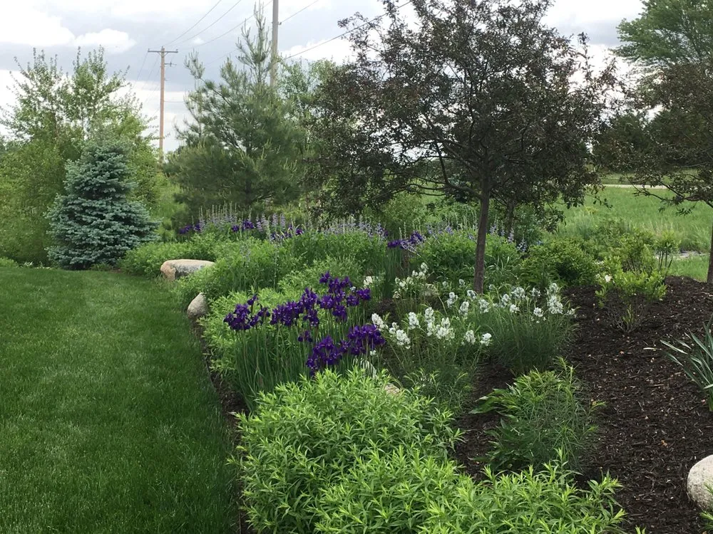 Local lawn mowing service for beautiful yards in Lincoln, NE by 3 Dogs & A Girl