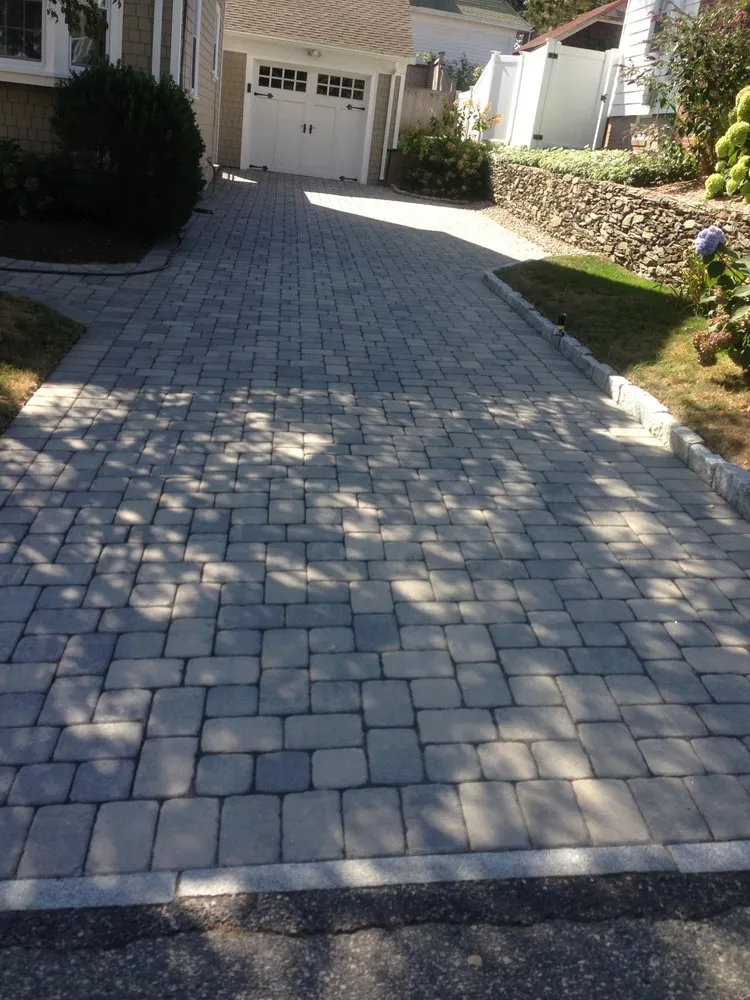 Custom outdoor landscaping for year-round maintenance in East Greenwich, RI by 3M Landscape Construction