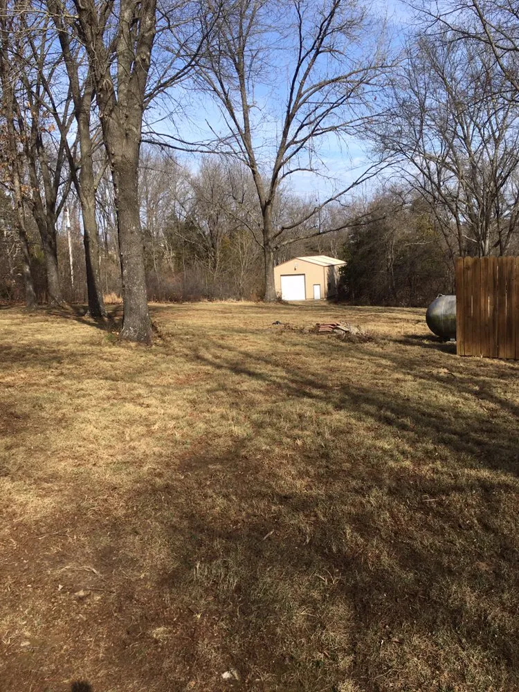 Local yard cleanup service for residential properties in Ozark, MO by A & T Lawn & Landscape