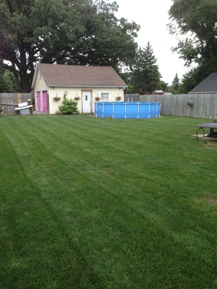 Custom landscape installation in Davenport, IA by A Cut Above Lawn and Landscape