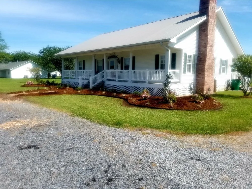 Custom outdoor landscaping with custom design in Opelousas, LA by A Much Better Cut Lawn and Landscaping