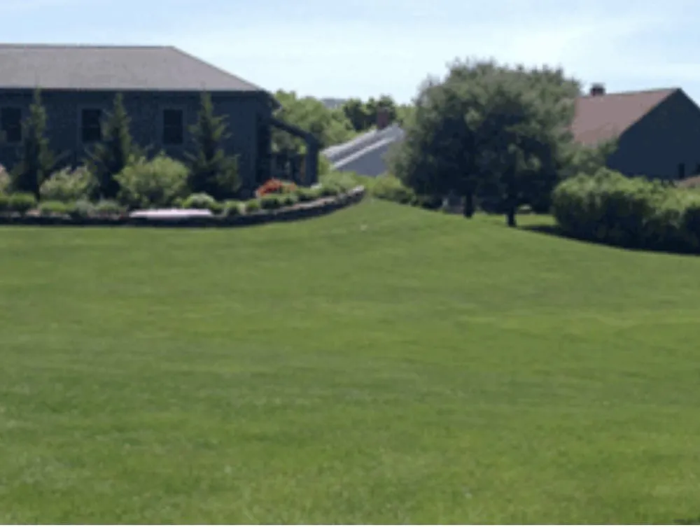 Custom landscape installation in Belmont, NH by A Plus Fertilizing