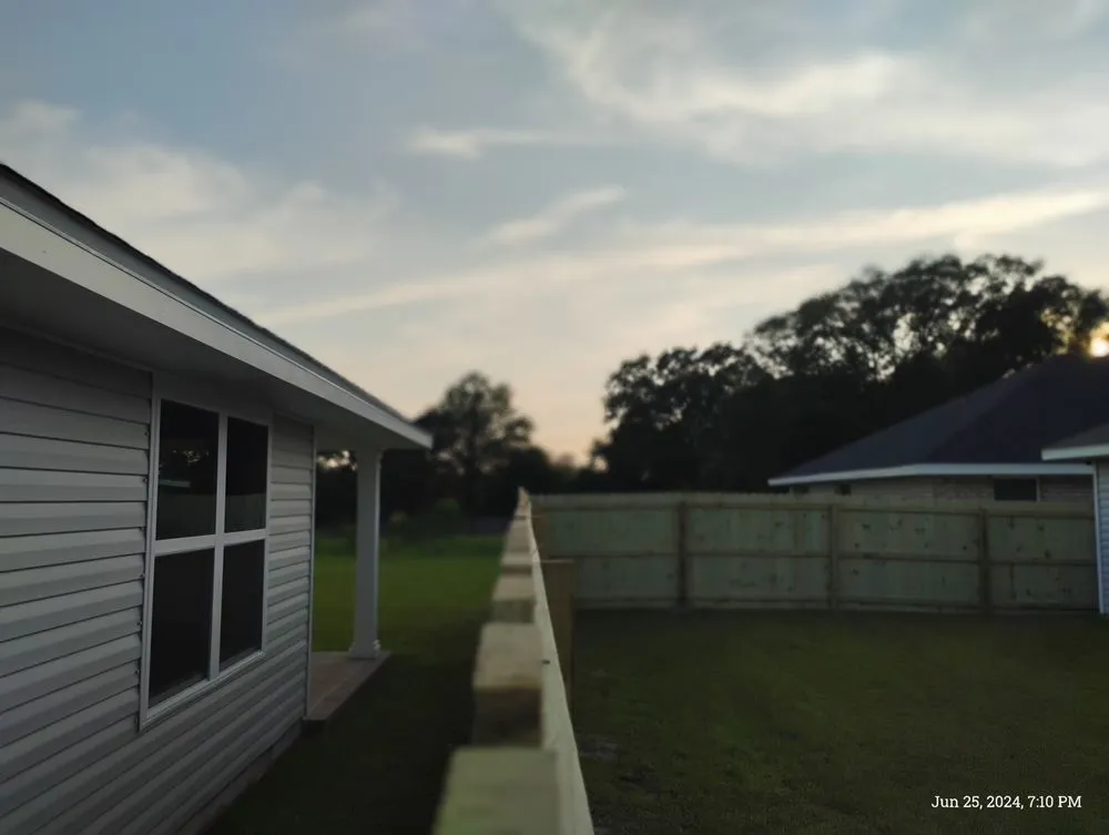 Professional lawn mowing service for residential properties in Pensacola, FL by A T D Landscapes and Fence