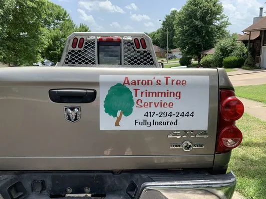 Aaron's Tree Trimming Service Logo