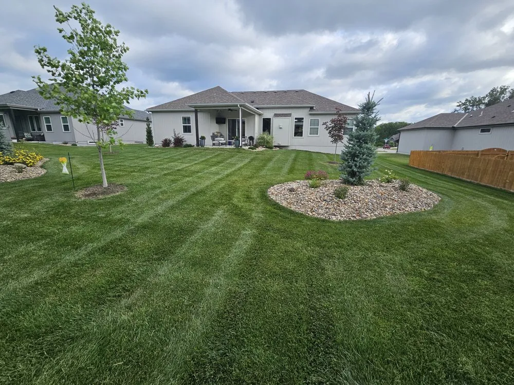 Custom lawn mowing service for outdoor upgrades in Warrensburg, MO by Above & Beyond Lawn Care