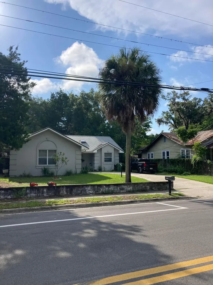 Professional lawn mowing service for year-round maintenance across Palatka, FL - Above The Standard