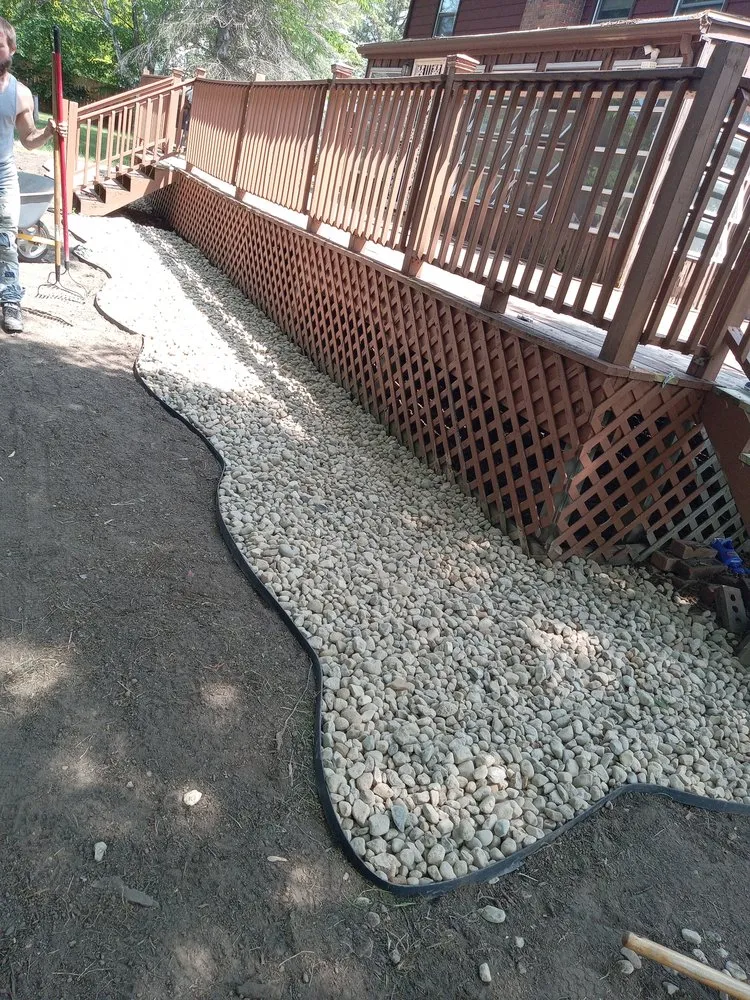 Professional outdoor landscaping with custom design in Flint, MI by Accumod Home Improvement