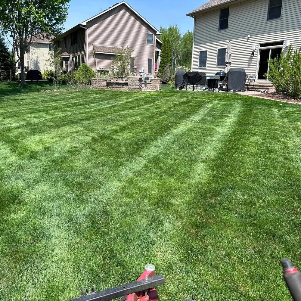 Expert lawn mowing service for residential properties in Apple Valley, MN by Ace of Spades