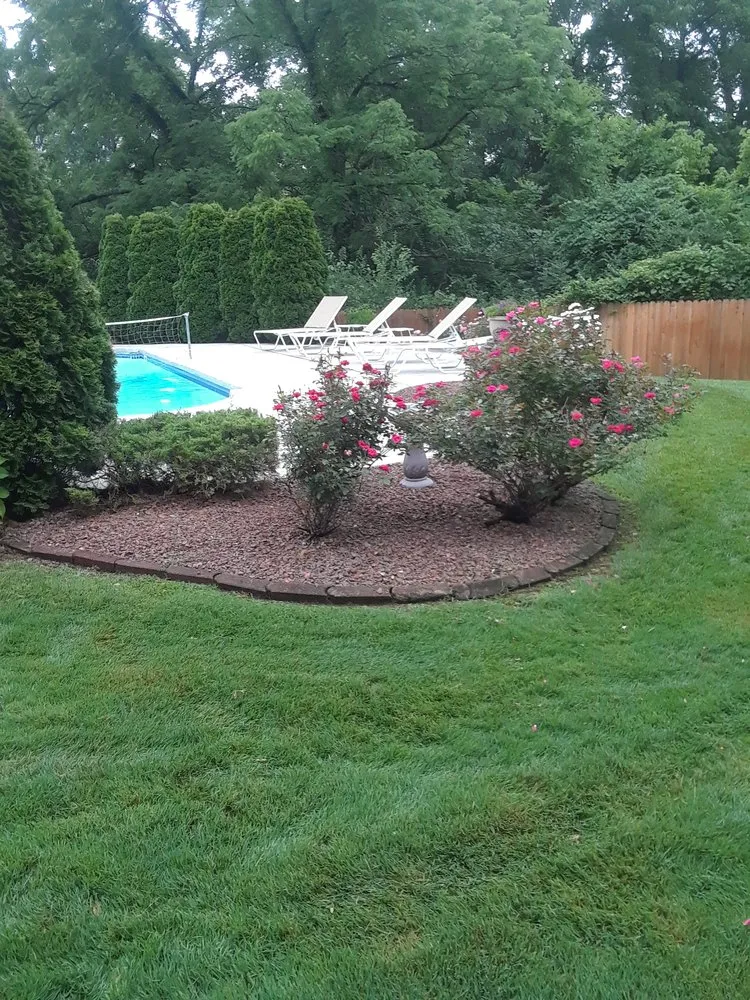 Custom landscape installation for residential properties in Louisville, KY by Act's 2 & 38 Lawn Care