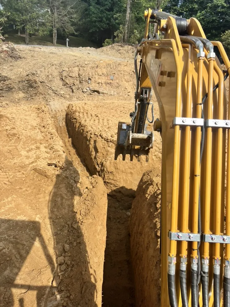 Affordable yard cleanup service for homes in Spruce Pine, NC by Adam Young Trucking & Grading