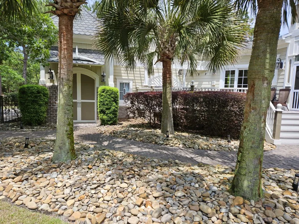 Trusted lawn mowing service with custom design in Sunset Beach, NC by Adams Exterior Designs