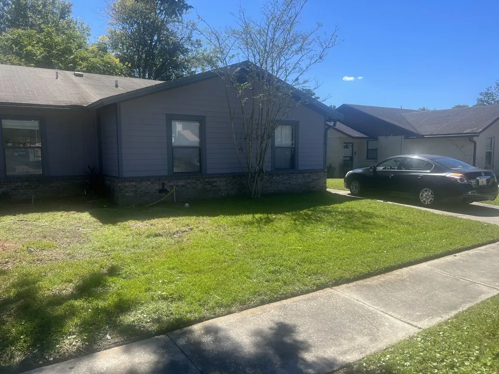 Professional lawn care service for residential properties in Jacksonville, FL by Addison Quality Lawn Care