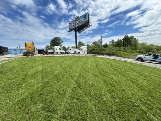 Ados Lawn Care And Landscaping Logo