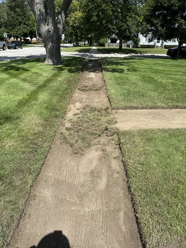 Expert lawn mowing service with custom design across North Street, MI - Advanced Lawn & Landscape