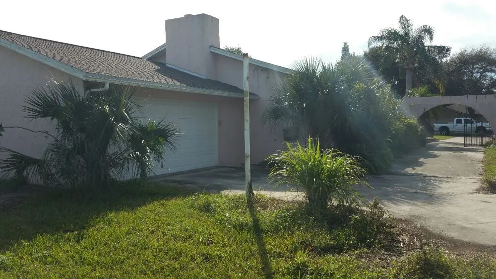 Custom landscape design for year-round maintenance in Cape Canaveral, FL by Affordable Lawns Of Brevard