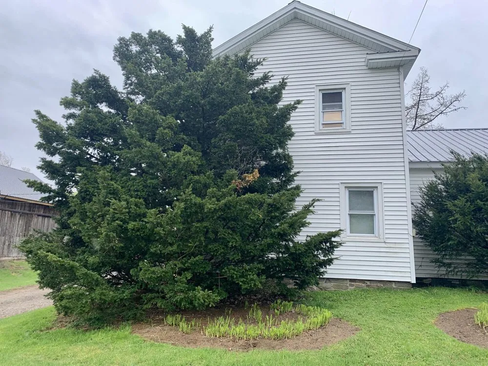 Trusted garden landscaping with custom design in Parish, NY by Against the Wind Lawn Care