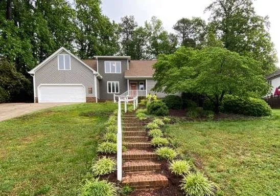 Custom garden landscaping for residential properties in Louisburg, NC by Alamo Landscaping and Concrete