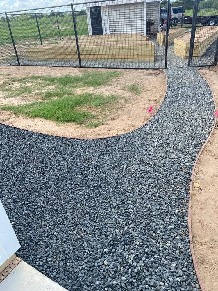 Custom outdoor landscaping in Bellville, TX by Alex Services