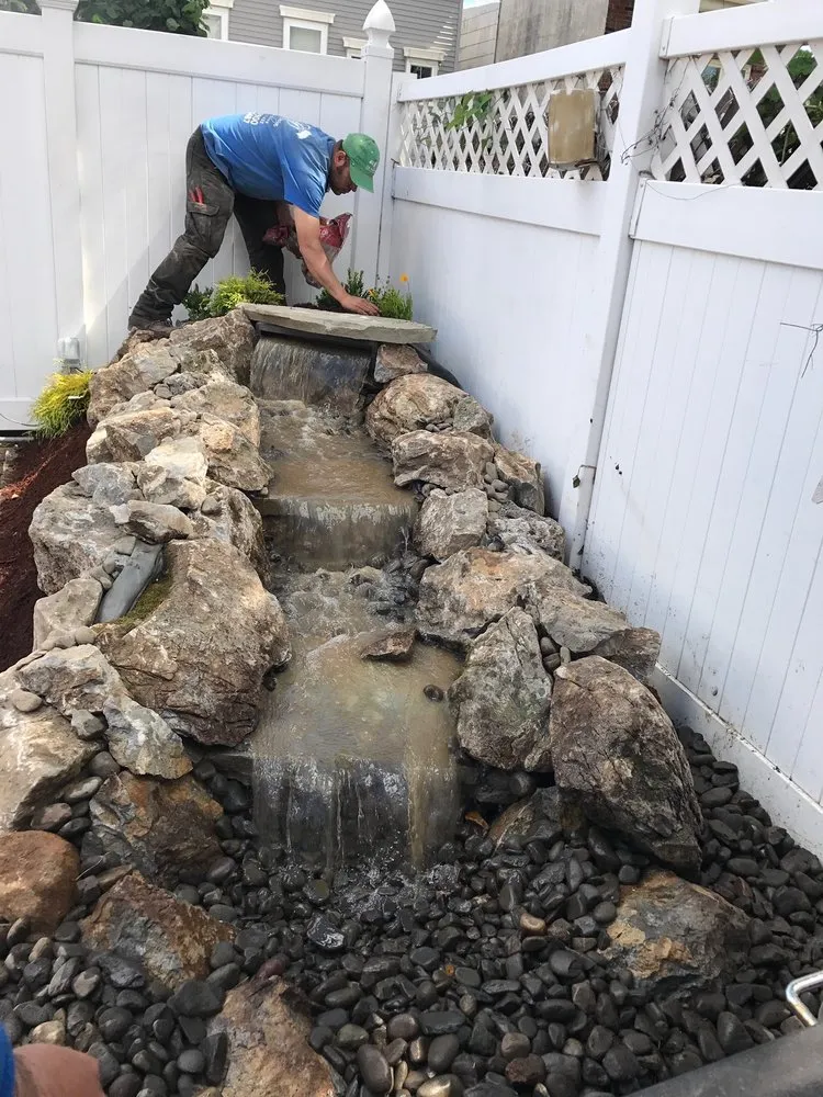 Custom outdoor landscaping in Rosedale, NY by Alexander Landscaping