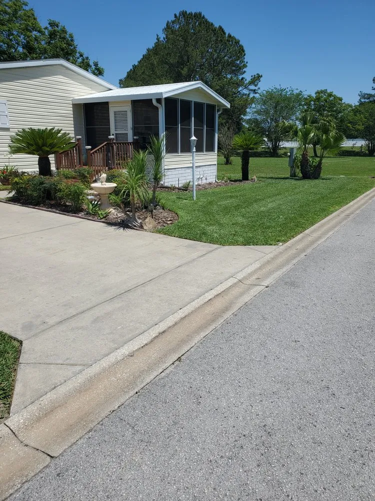 Professional lawn care service for residential properties in Ocklawaha, FL by Alfonso Lawn & Landscaping