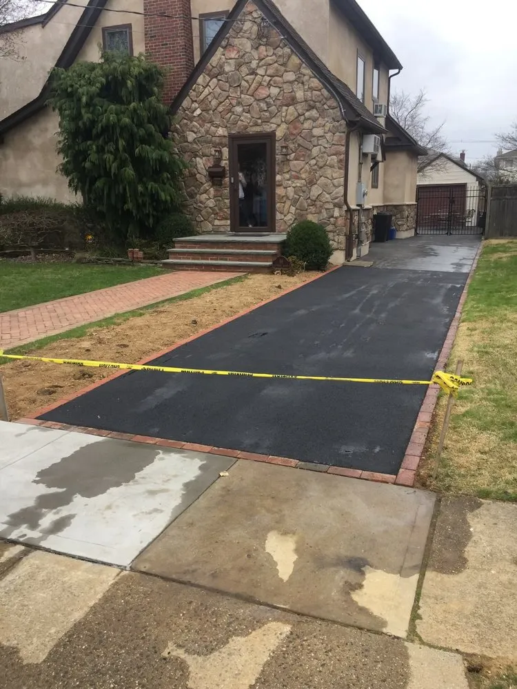 Local yard cleanup service for residential properties in Elmont, NY by Alfredo’s Construction