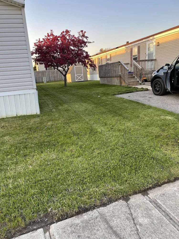 Local lawn mowing service for residential properties in Brownstown, MI by All Above & Beyond Services