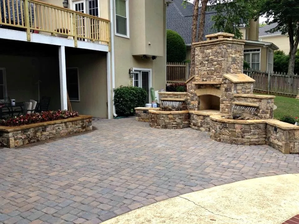 Professional lawn care service for year-round maintenance in Woodstock, GA by All American Landscape and Stone