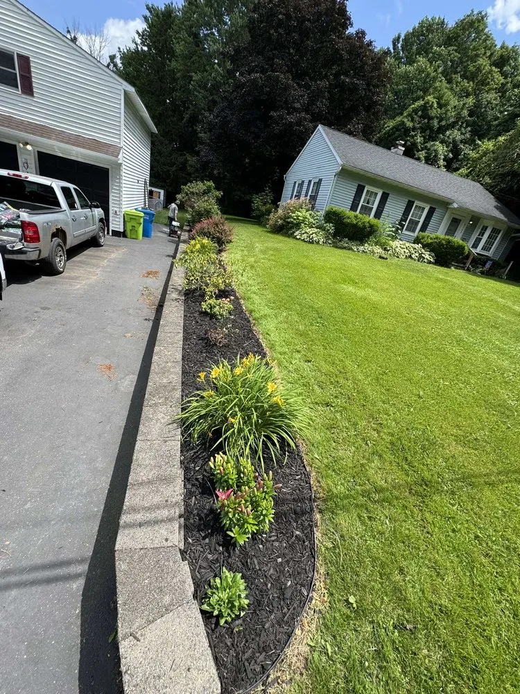 Custom yard cleanup service for homes in Chittenango, NY by All In The Family Lawn Care
