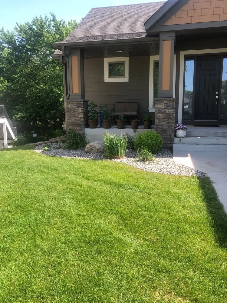 Custom landscaping services for year-round maintenance in Blaine, MN by All Over Elementz Outdoor Services