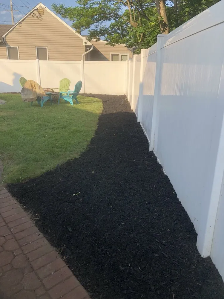 Custom garden landscaping for year-round maintenance across Massapequa, NY - All Pro Lawn Care & Design