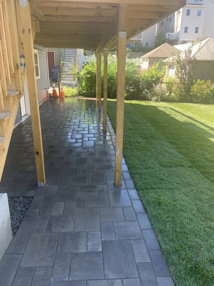 Reliable lawn care service for residential properties across Roslindale, MA - All Star Landscaping & Masonry