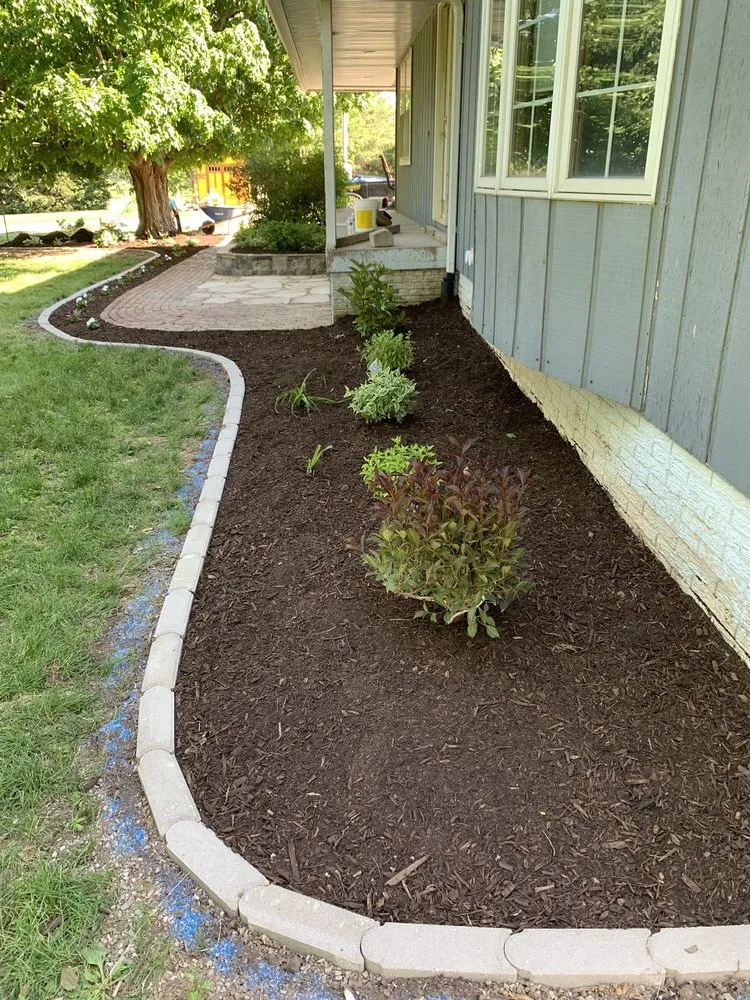 Professional lawn mowing service for year-round maintenance in West Liberty, IA by All Terra Landscape & Design