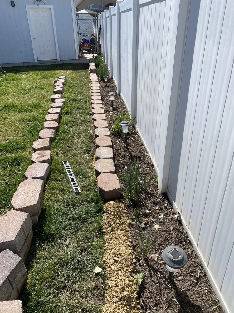 Professional lawn care service for year-round maintenance in Herriman, UT by ALLL and Landscaping