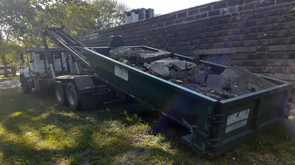 Custom yard maintenance for year-round maintenance in Cleveland, OH by ALM Dumpster Services