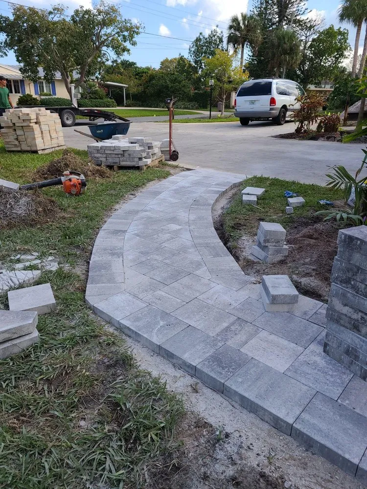 Trusted lawn mowing service in Palm City, FL by Alpha Zeta Landscaping