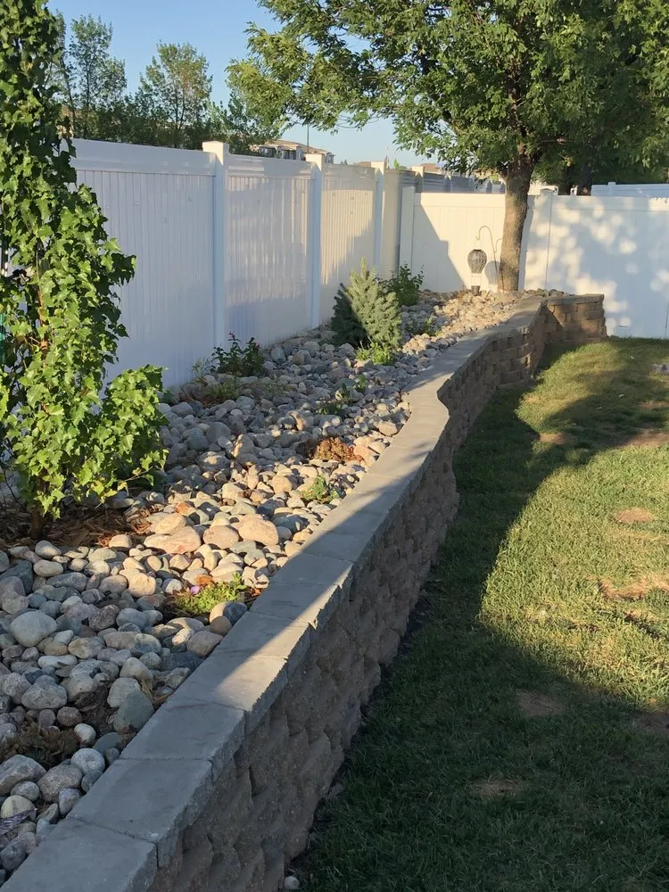 Local yard cleanup service for residential properties in Grand Forks, ND by AM Landscaping