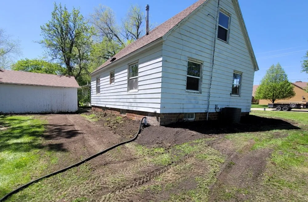 Custom landscape installation for homes in Manson, IA by AmB Services