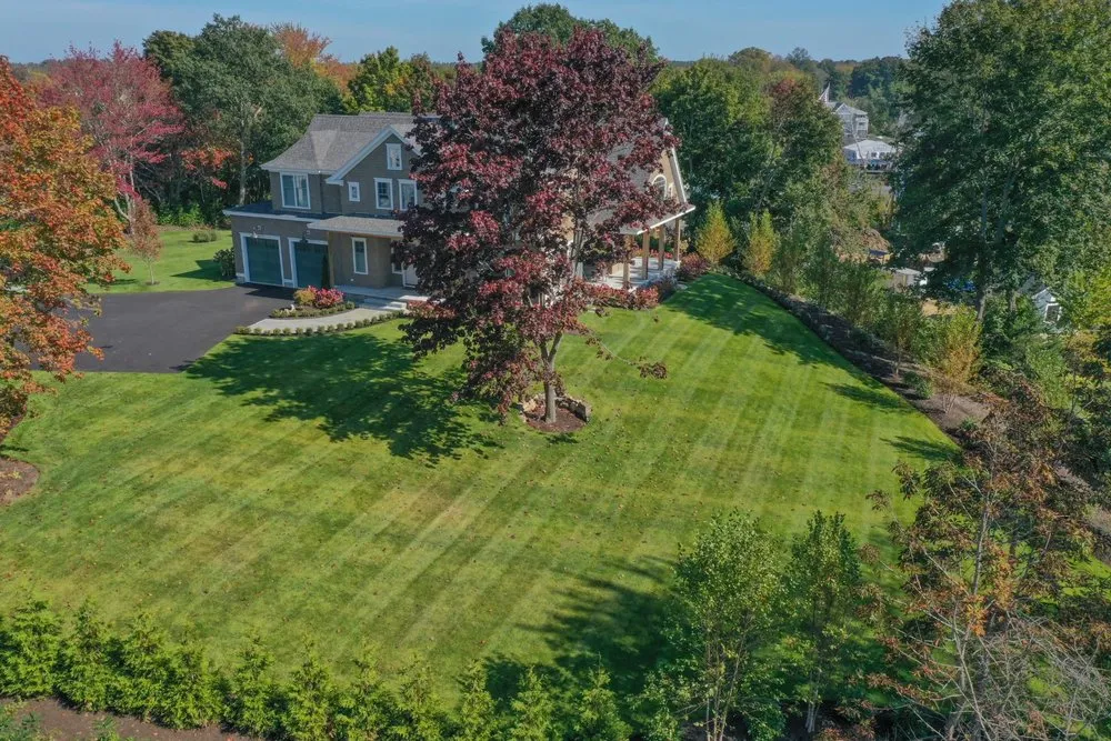 Custom lawn mowing service with custom design across Arundel, ME - Ambidextrous