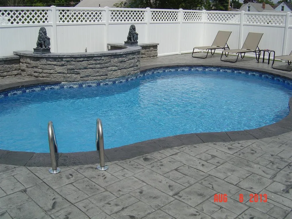 Affordable lawn care service for year-round maintenance in Albany, NY by American Design & Contracting