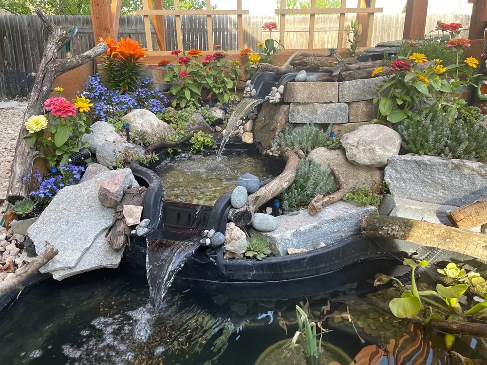 Affordable lawn mowing service for year-round maintenance in Salt Lake City, UT by American Stone