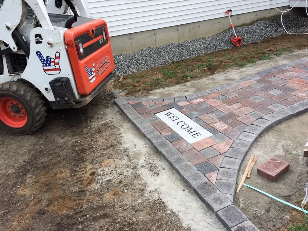 Professional lawn care service in Hudson, NH by American Wall and Patio