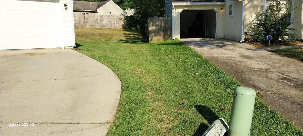 Professional lawn mowing service for outdoor upgrades in Rex, GA by Amerson & Son Lawn Home Improvement
