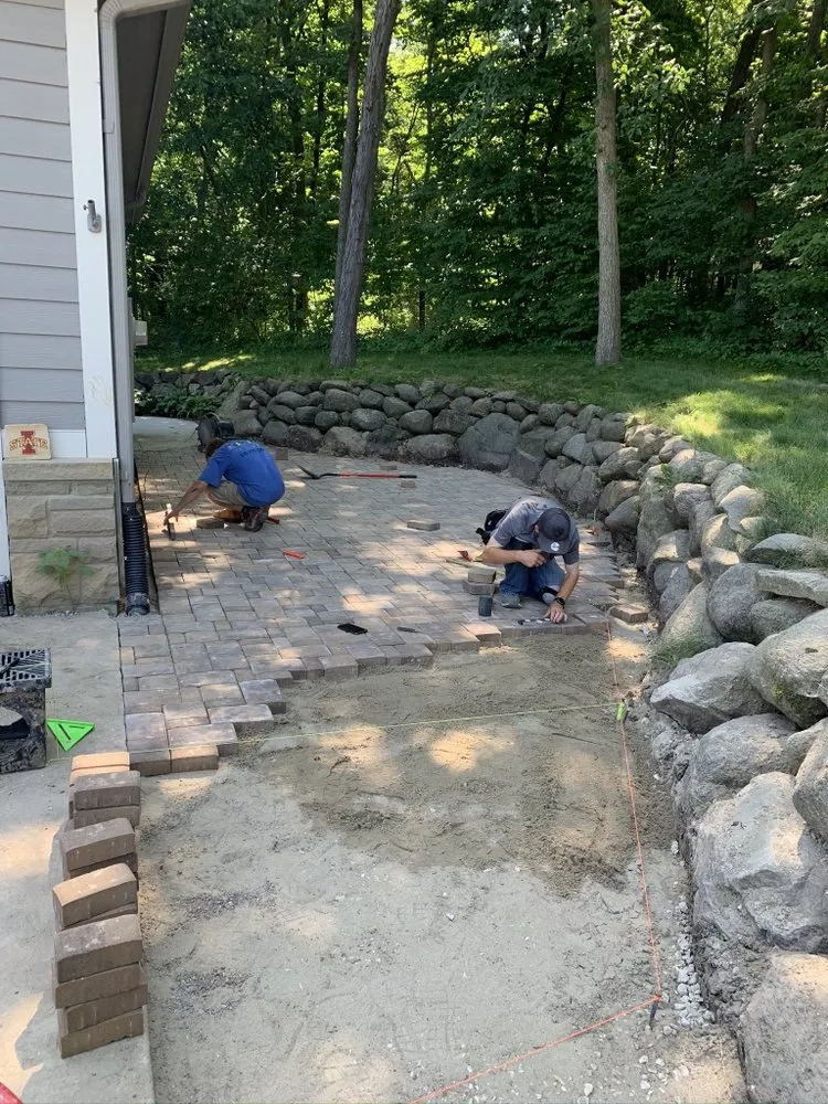Custom landscape design with custom design in Urbandale, IA by AMP Construction and Landscaping