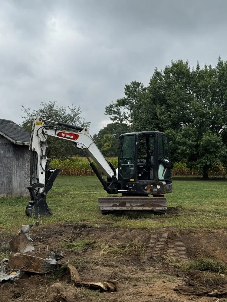 Custom landscape installation in Waterport, NY by Amp Lawn Care Service