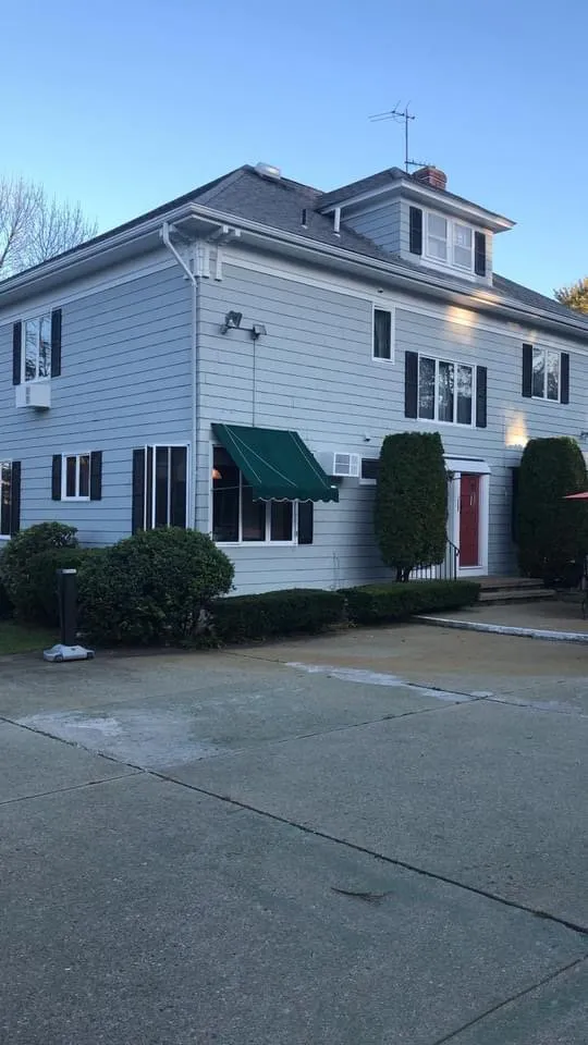 Local yard cleanup service with custom design in East Providence, RI by Anchored Property Maintenance