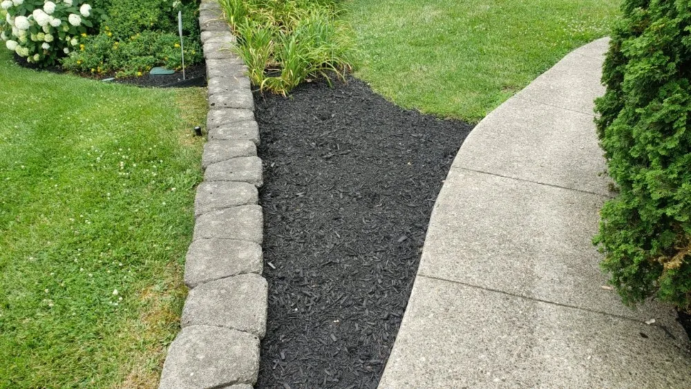 Custom landscape installation for residential properties in Georgetown, KY by Angels Lawncare