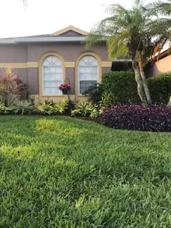 Custom lawn mowing service for homes in Sarasota, FL by Anglo American Services