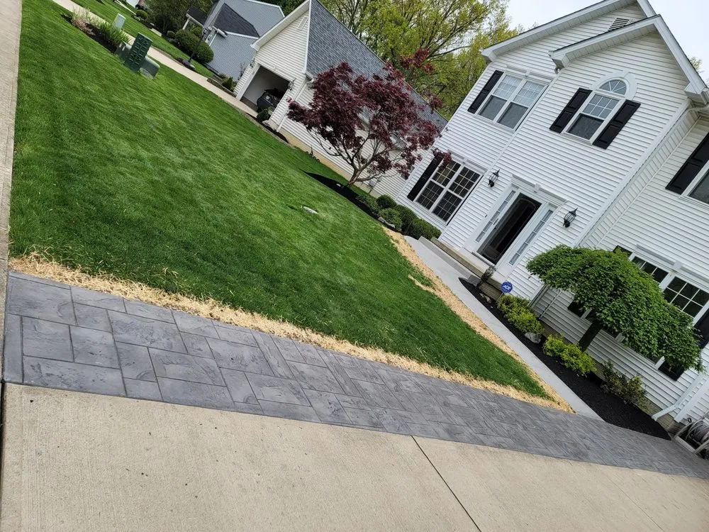 Custom landscape design for outdoor upgrades in Lorain, OH by Anything Green Lawn Care & Landscaping