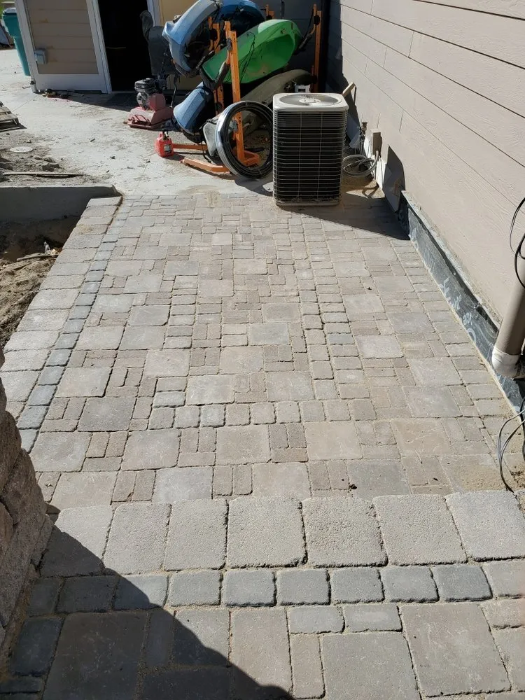 Professional lawn mowing service for outdoor upgrades in Denver, CO by API Services